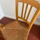 Trio of vintage straw/colored chairs