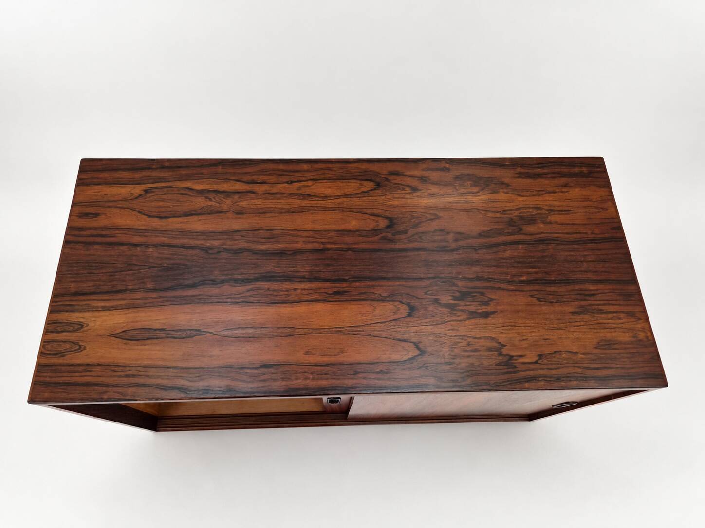 Low sideboard in rosewood with sliding doors. Denmark, 1960s