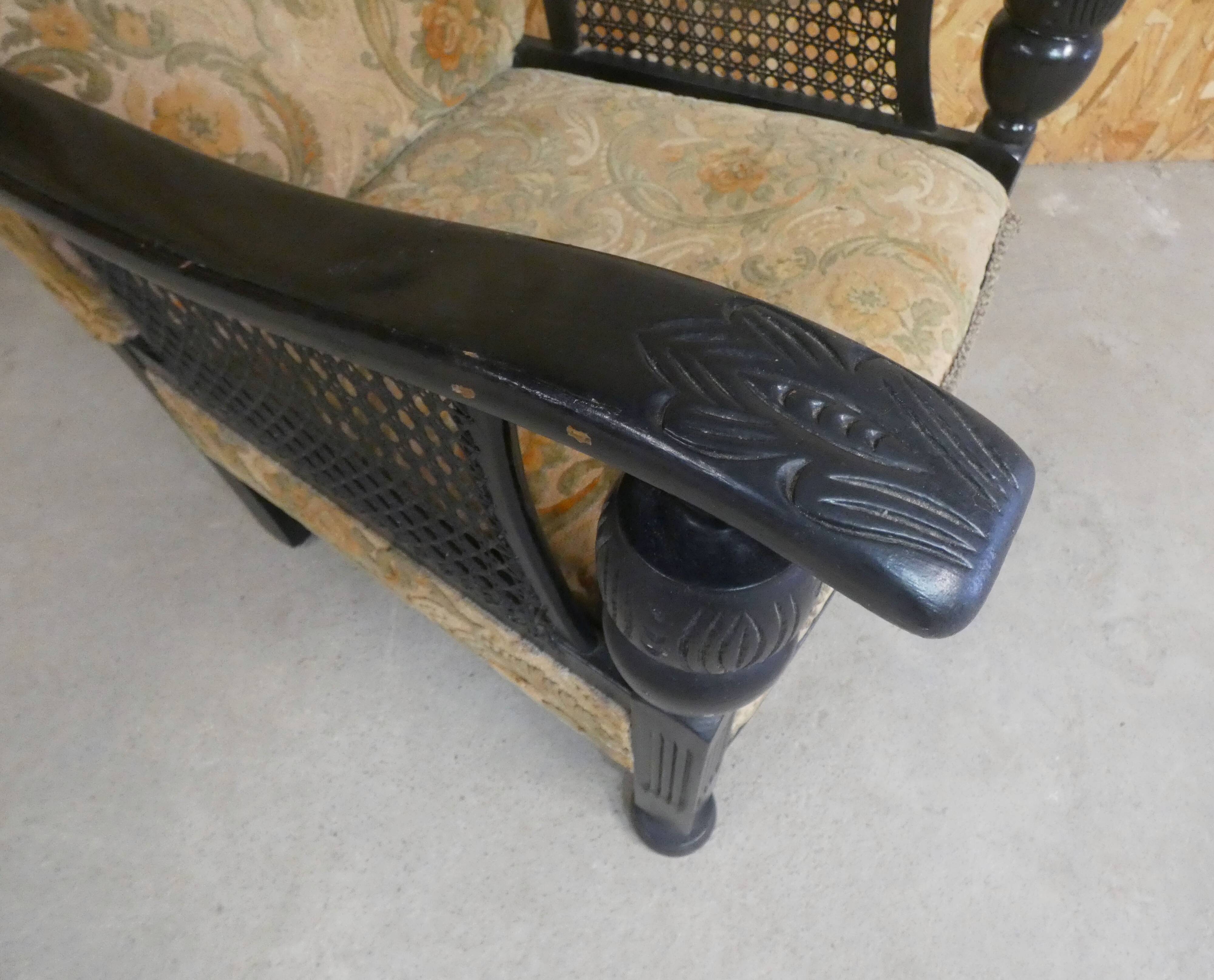 Old armchair upholstered in velvet, carved and caned wood