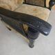 Old armchair upholstered in velvet, carved and caned wood