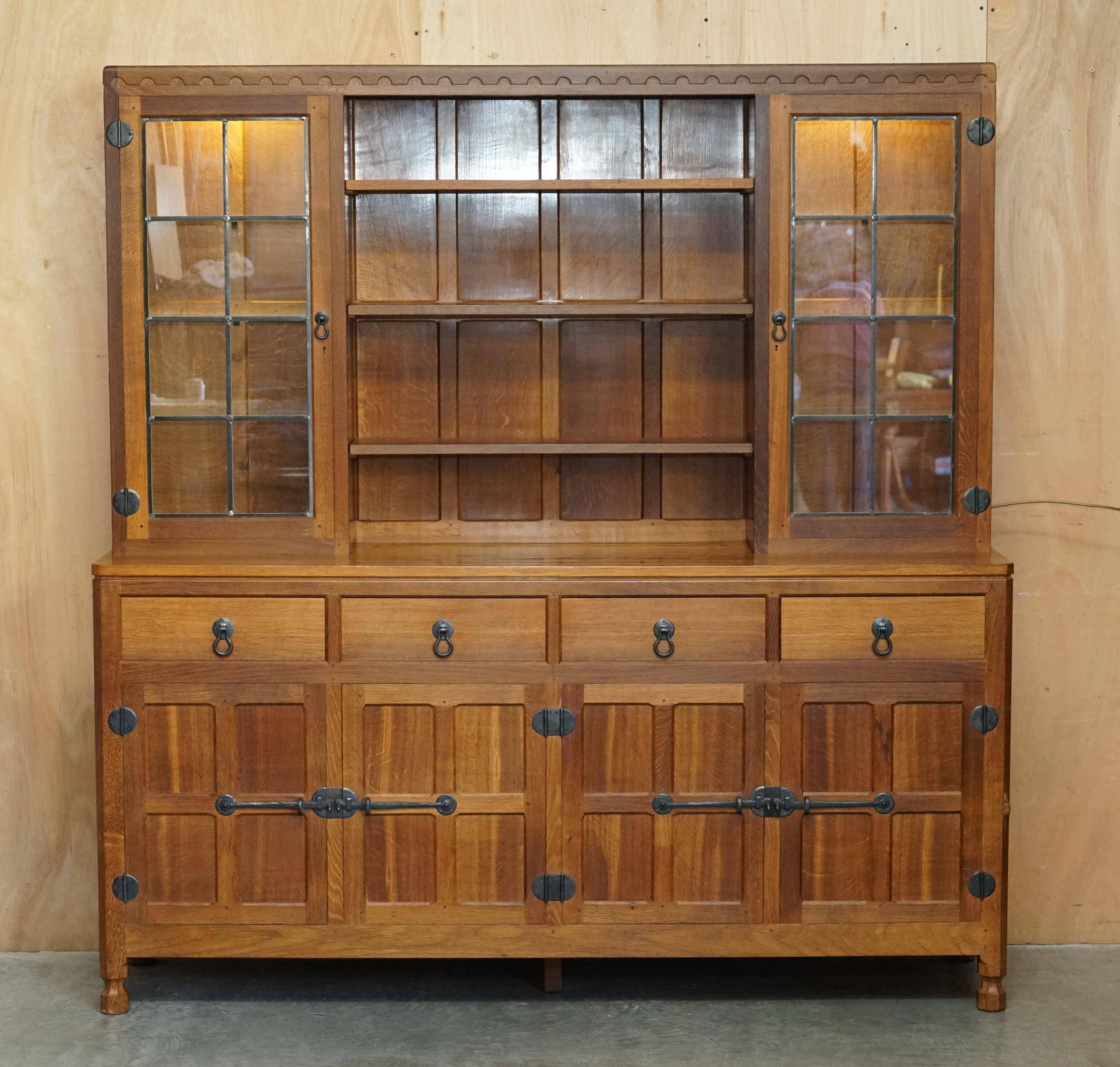 Vintage Robert Mouseman Thompson oak display cabinet with shelves and lighting.
