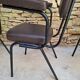 Brown faux leather armchairs