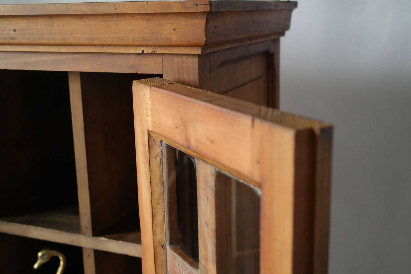 Antique walnut display cabinet from the 20th century.