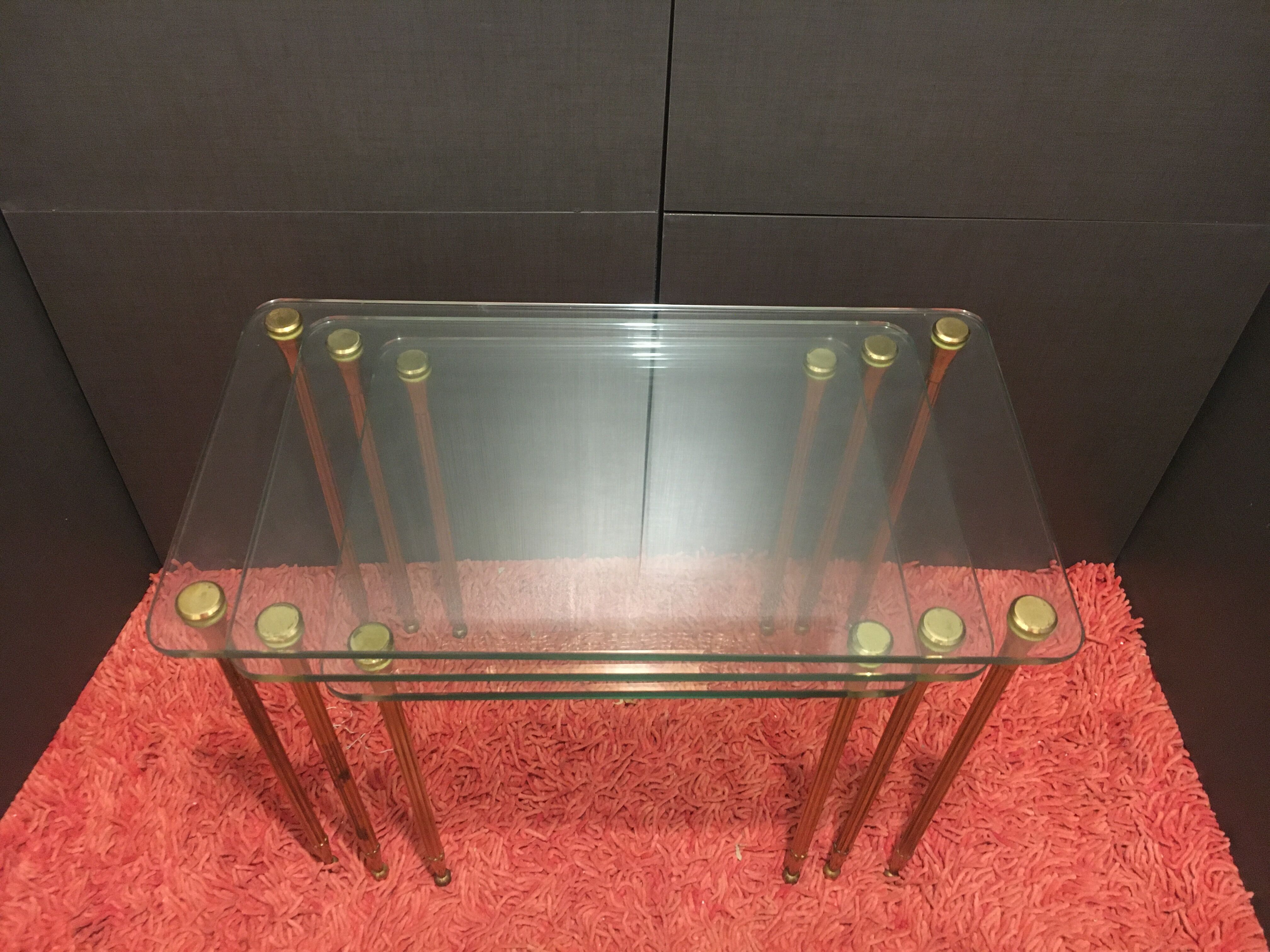 Brass and glass trundle tables