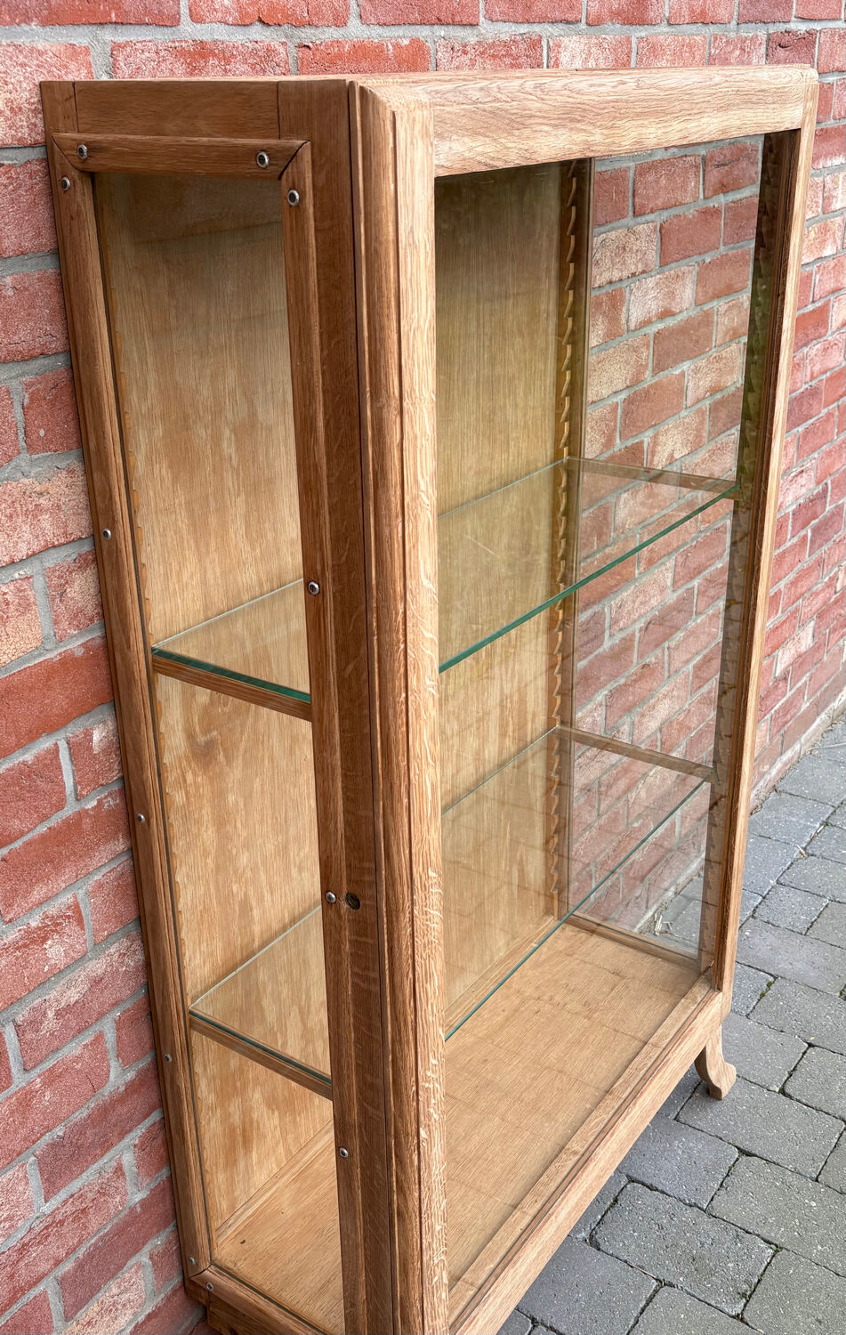 Restored antique oak display cabinet with glass shelves.