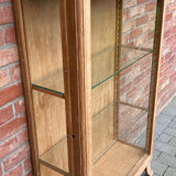 Restored antique oak display cabinet with glass shelves.