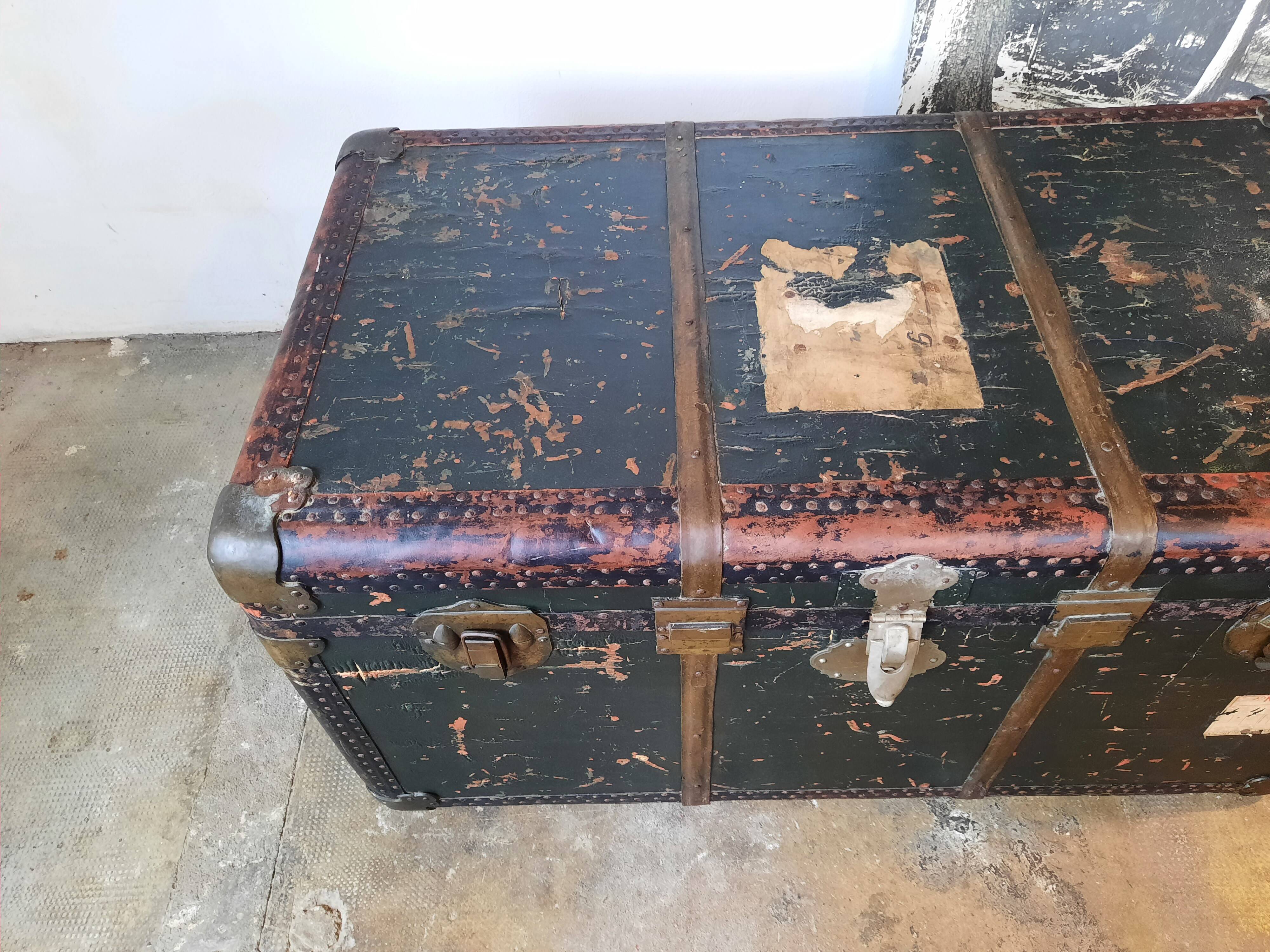 Old and large travel trunk, brass-plated corners