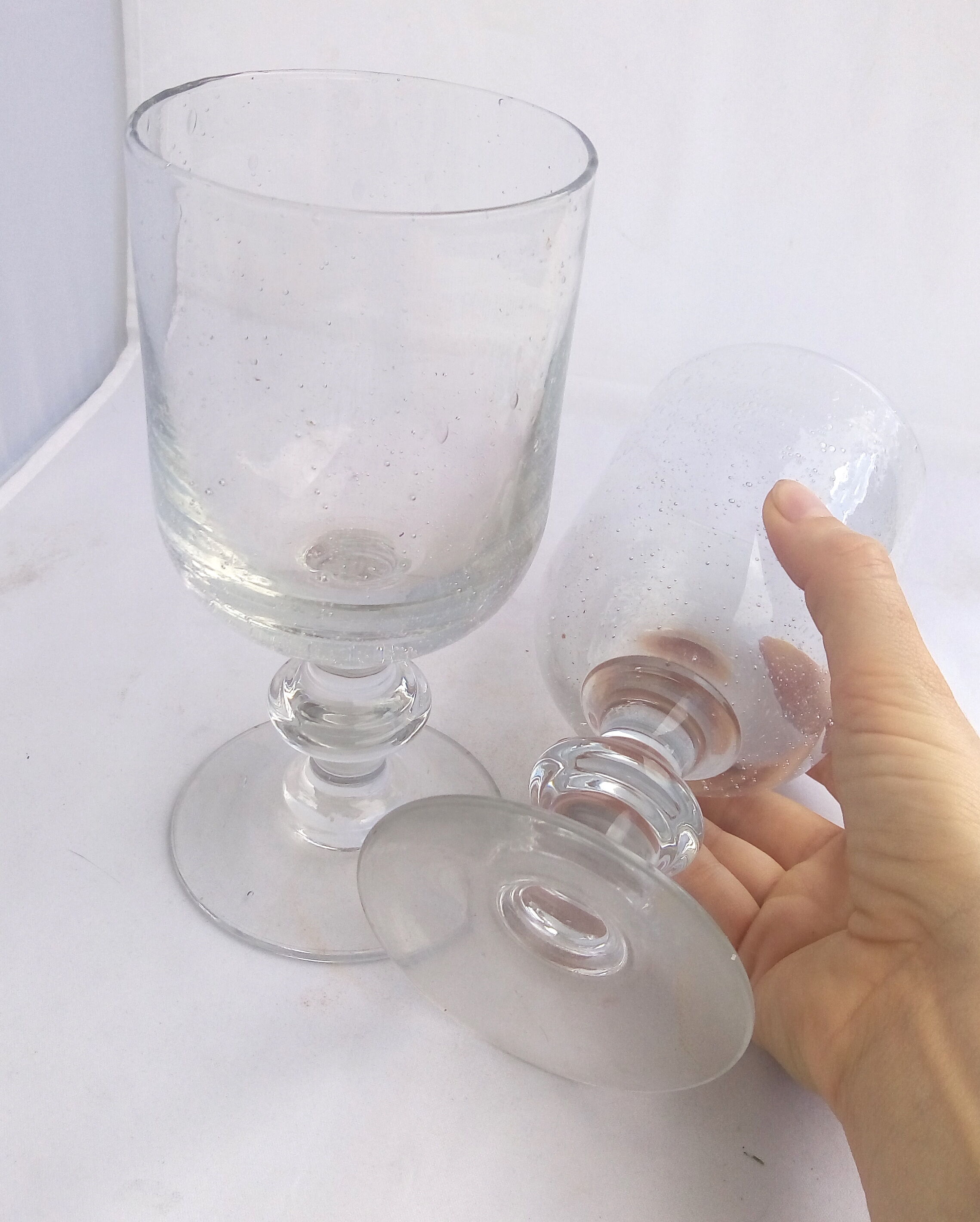 Duo of glasses with bullied glass