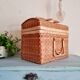 Small suitcase in vintage rattan trunk