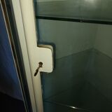 Painted metal ophthalmologist's corner display case, early 20th century