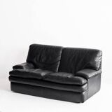 Black leather two-seater sofa. Roche Bobois edition. France, 1980s.