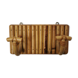 Wall coat holder in rattan
