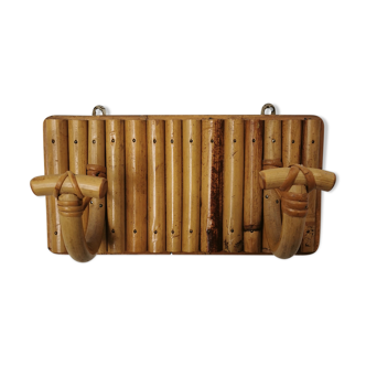 Wall coat holder in rattan