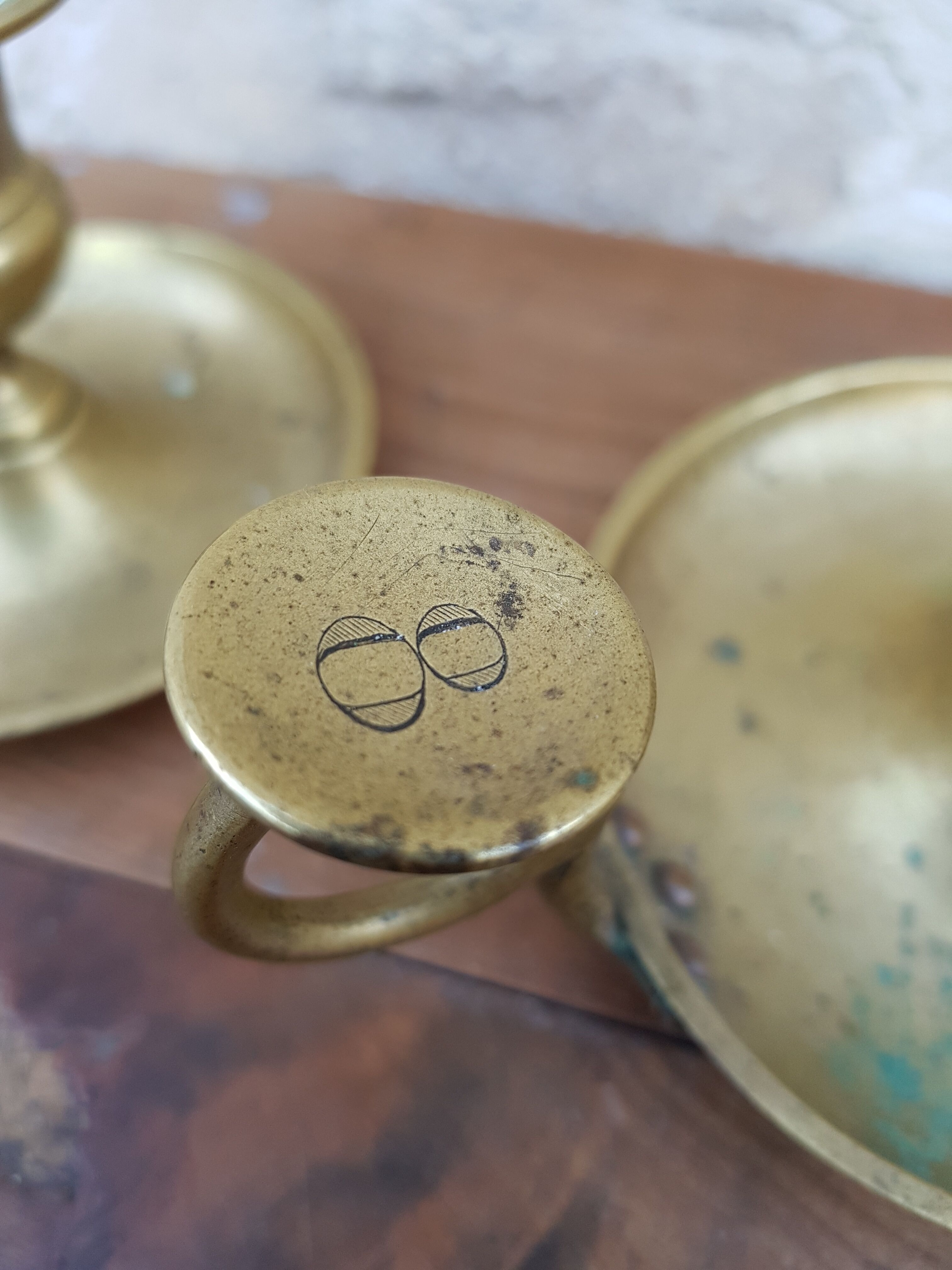 Old pair of brass candlesticks cellar rats
