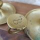 Old pair of brass candlesticks cellar rats