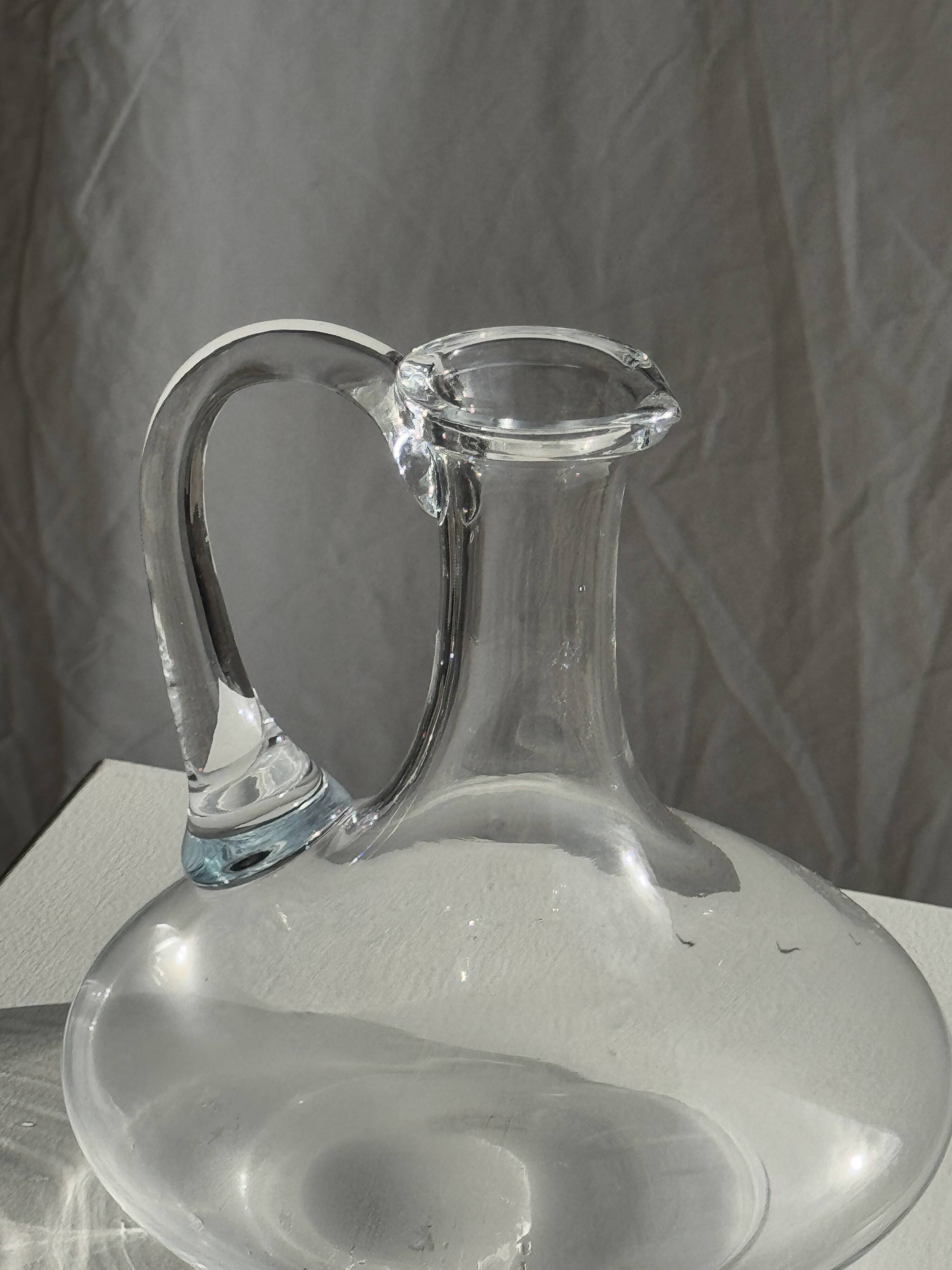 Vintage glass carafe with flattened flared belly handle H18
