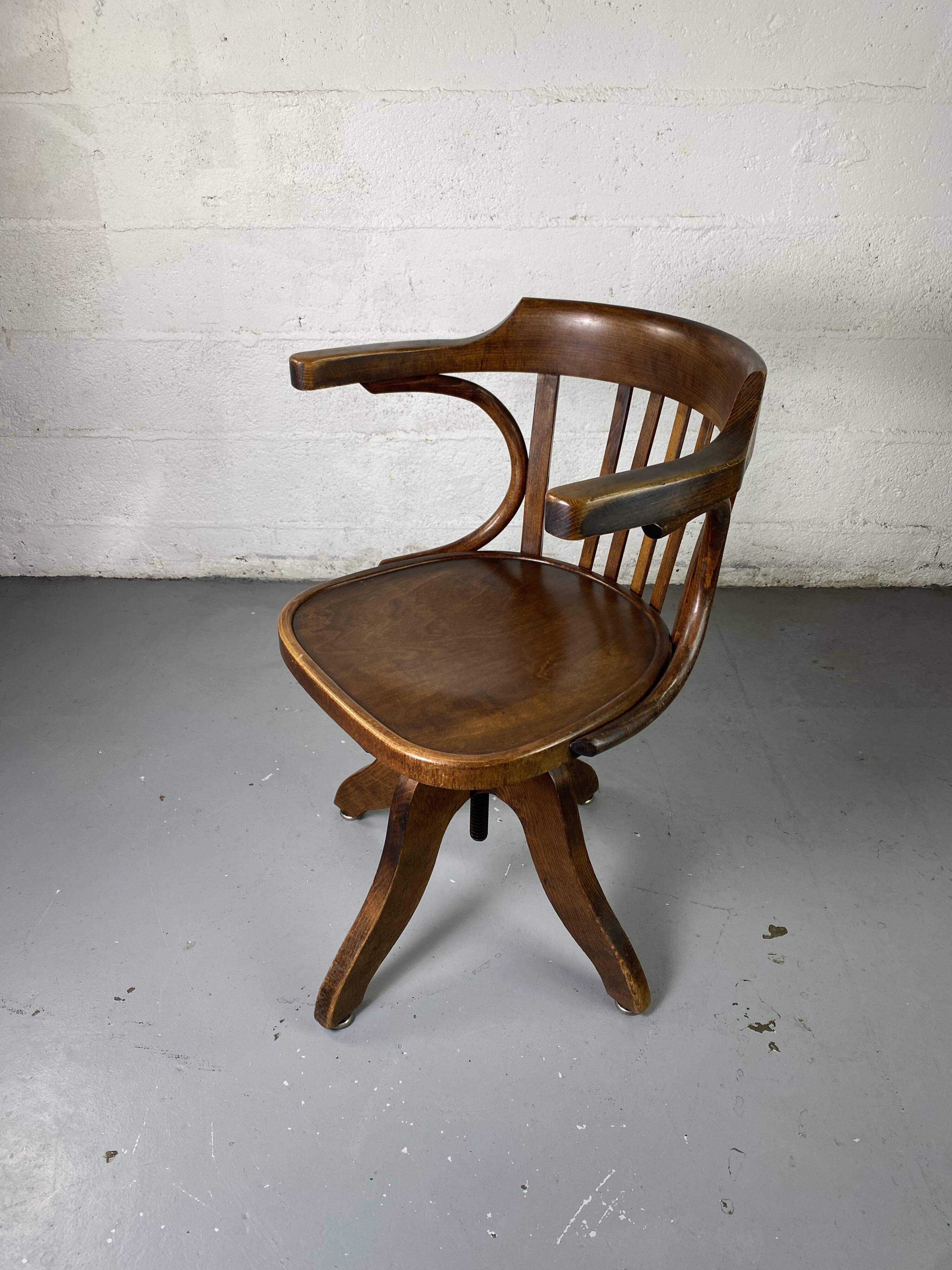 Baumann rotating wooden armchair