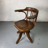 Baumann rotating wooden armchair