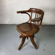 Baumann rotating wooden armchair