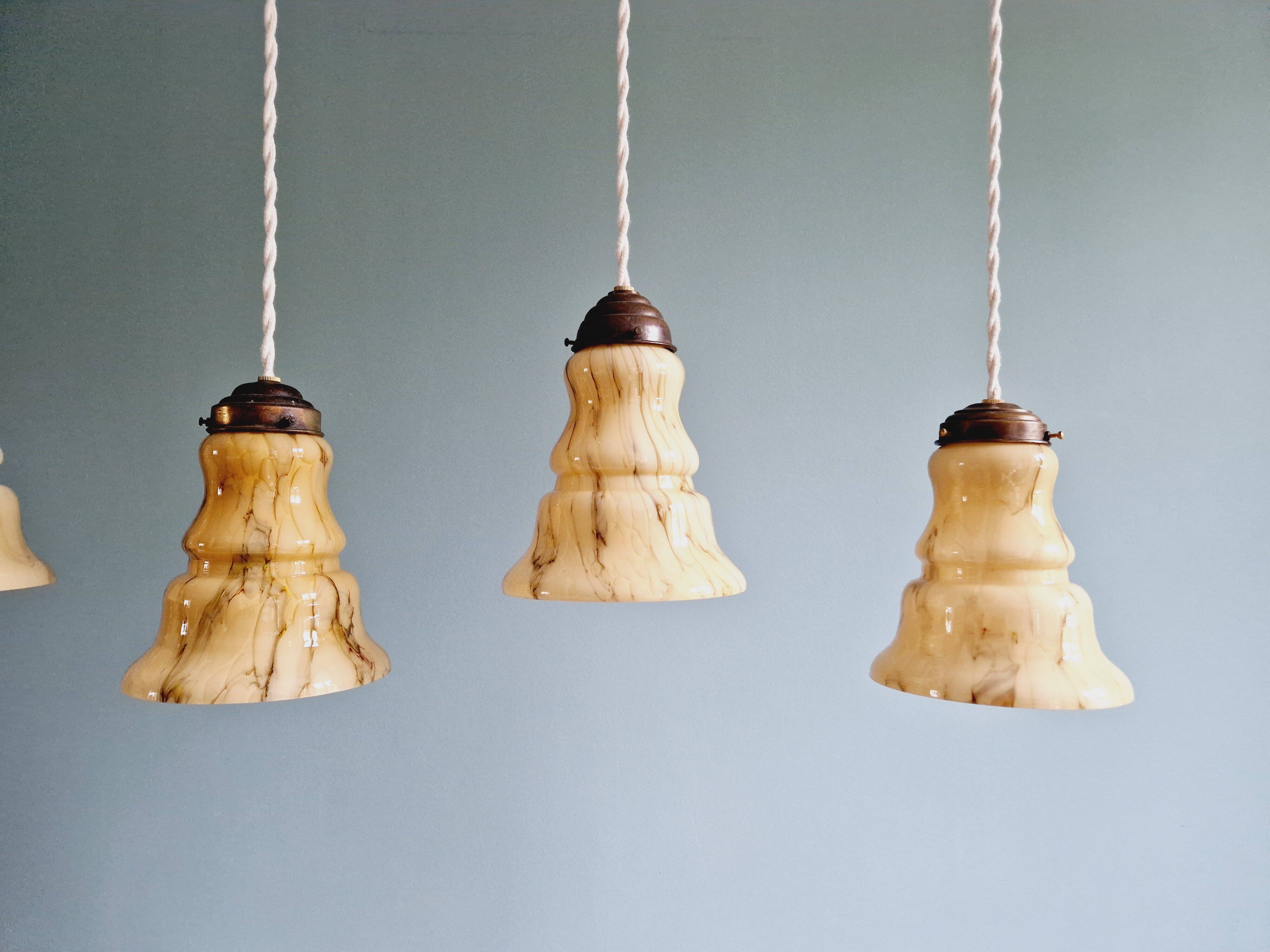 Set of 3 Art Deco marbled opaline pendant lights, 1920s-30s