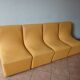 Set of 4 vintage 70s/80s armchairs in mustard yellow faux leather.