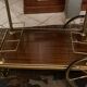 Servant table in gilded metal and mahogany mid-twentieth century