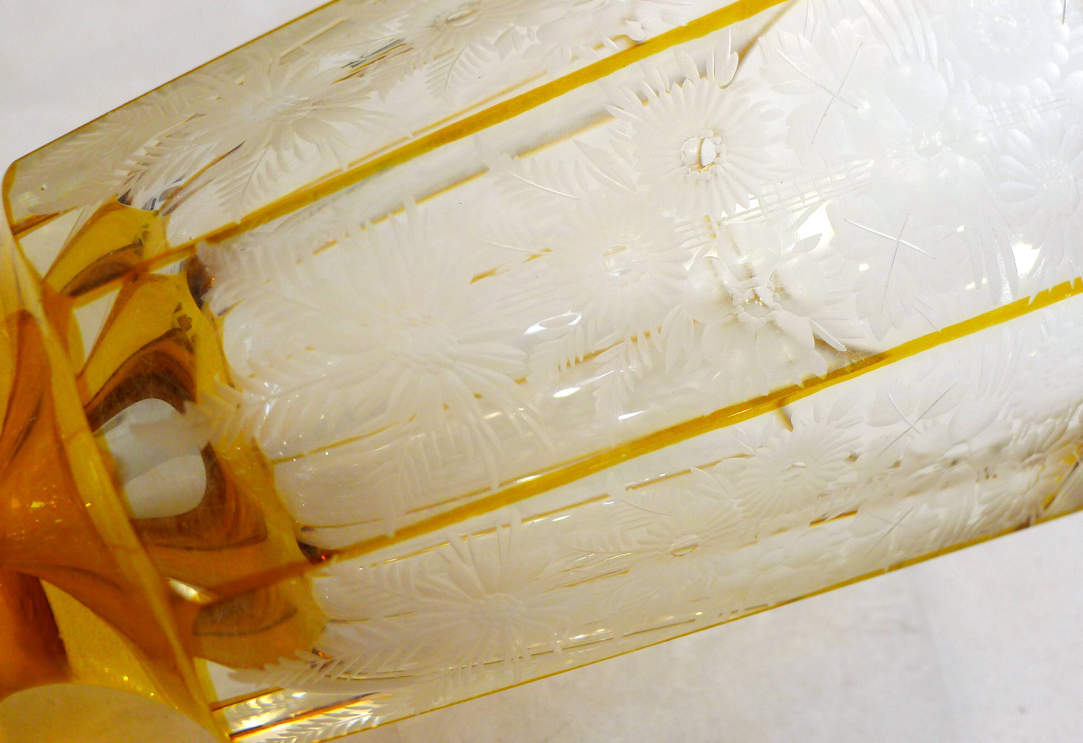 Art Deco vase engraved with flowers, faceted body on a pedestal.