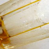 Art Deco vase engraved with flowers, faceted body on a pedestal.