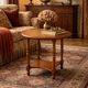Occasional table in antique oak with spool legs.