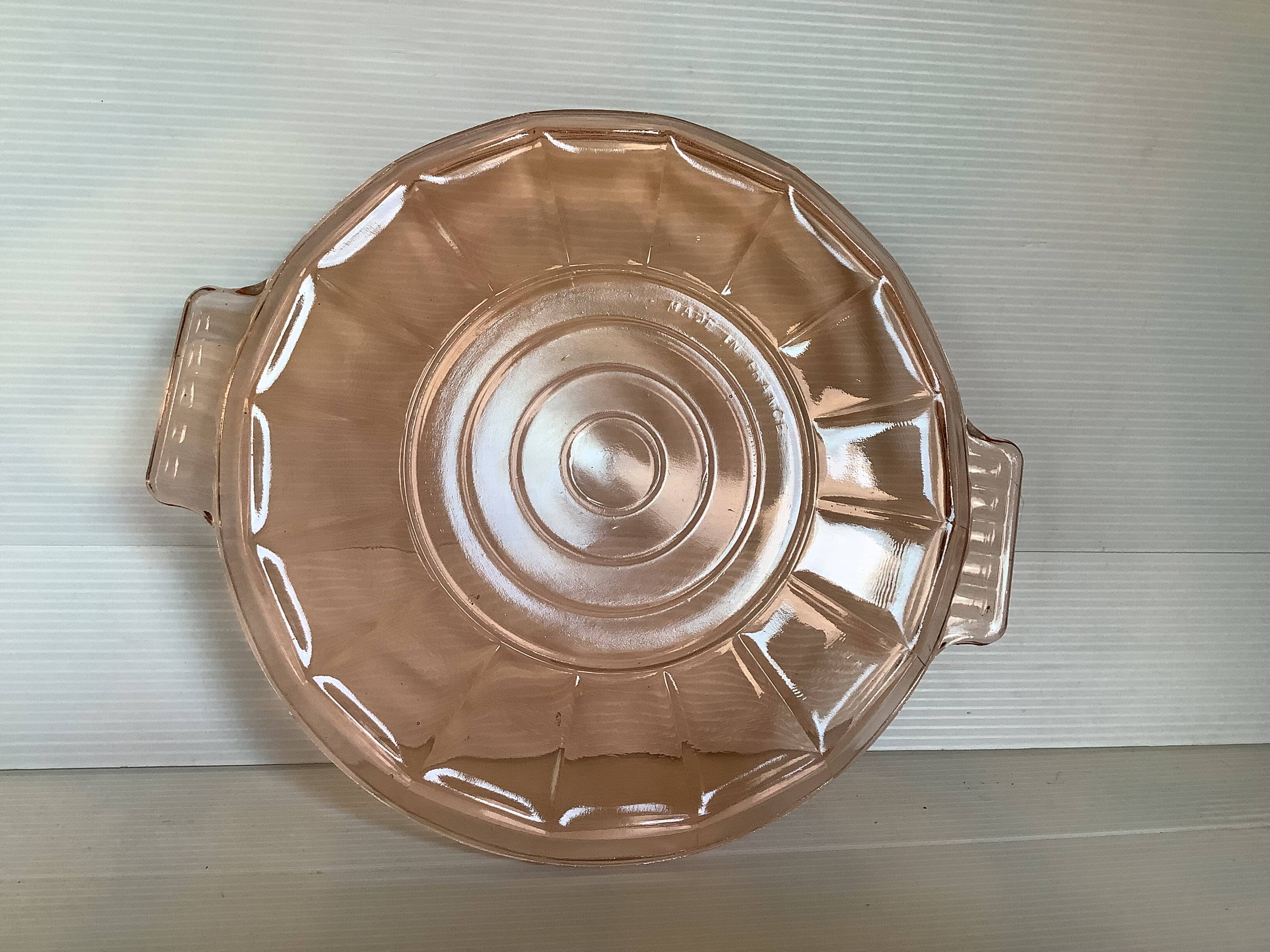 Pink glass plate with handles in Rosaline style.