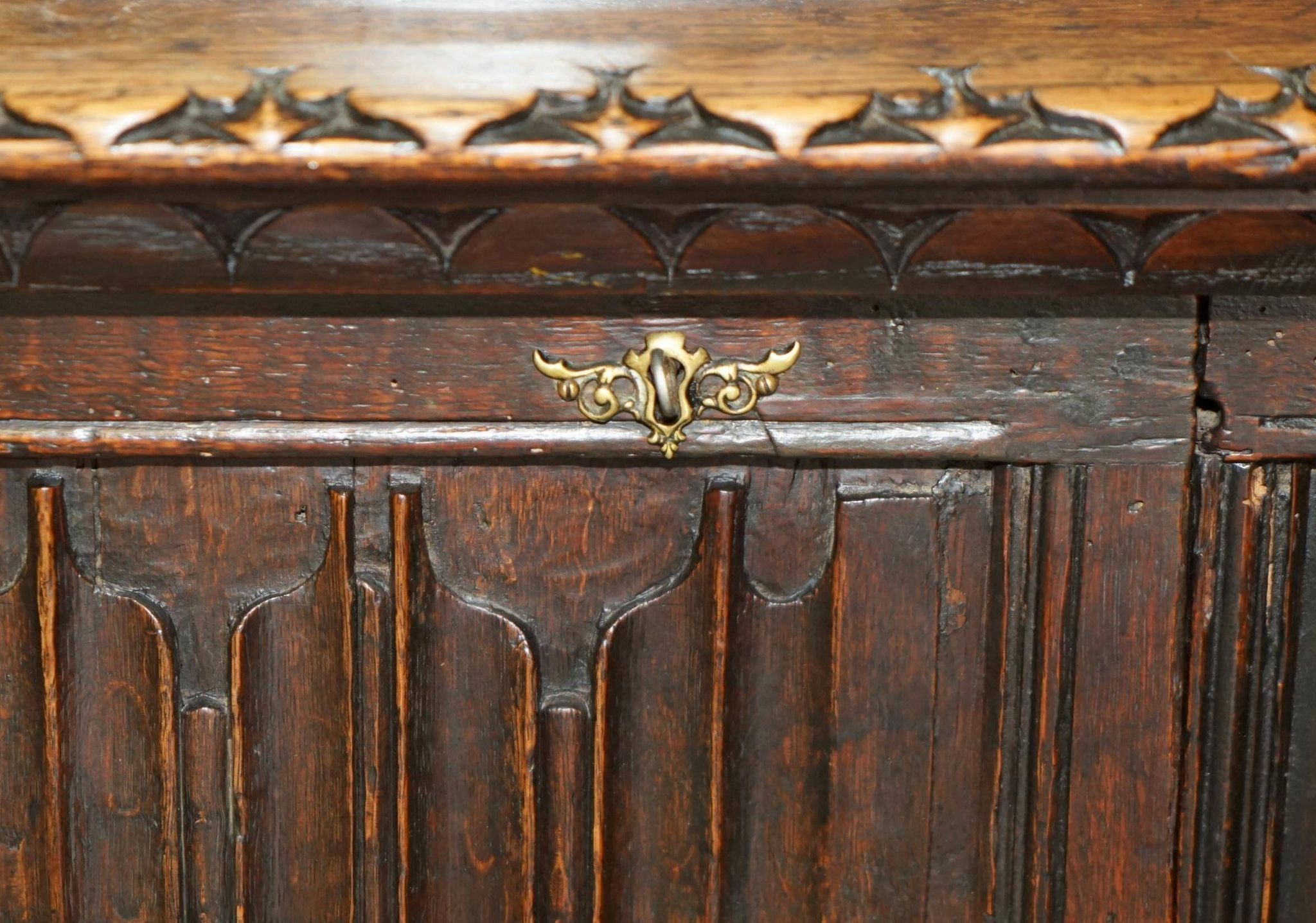 Jacobean hardwood library with carved panels and glass doors.