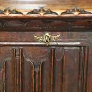 Jacobean hardwood library with carved panels and glass doors.