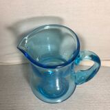 Old blue blown glass pitcher with vintage handle