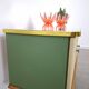 Vintage green DDR cabinet, model Libelle with glass top, slanted legs.