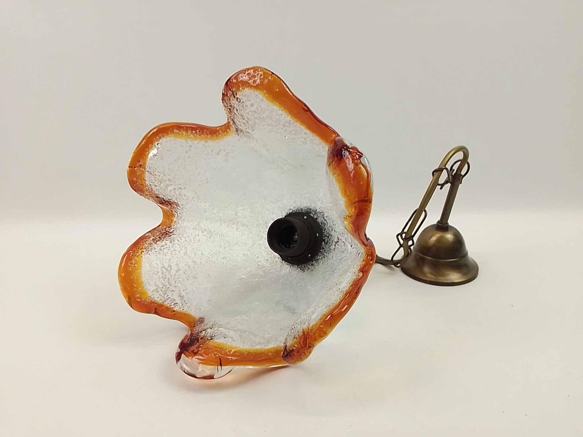 Clear glass chandelier and orange edge