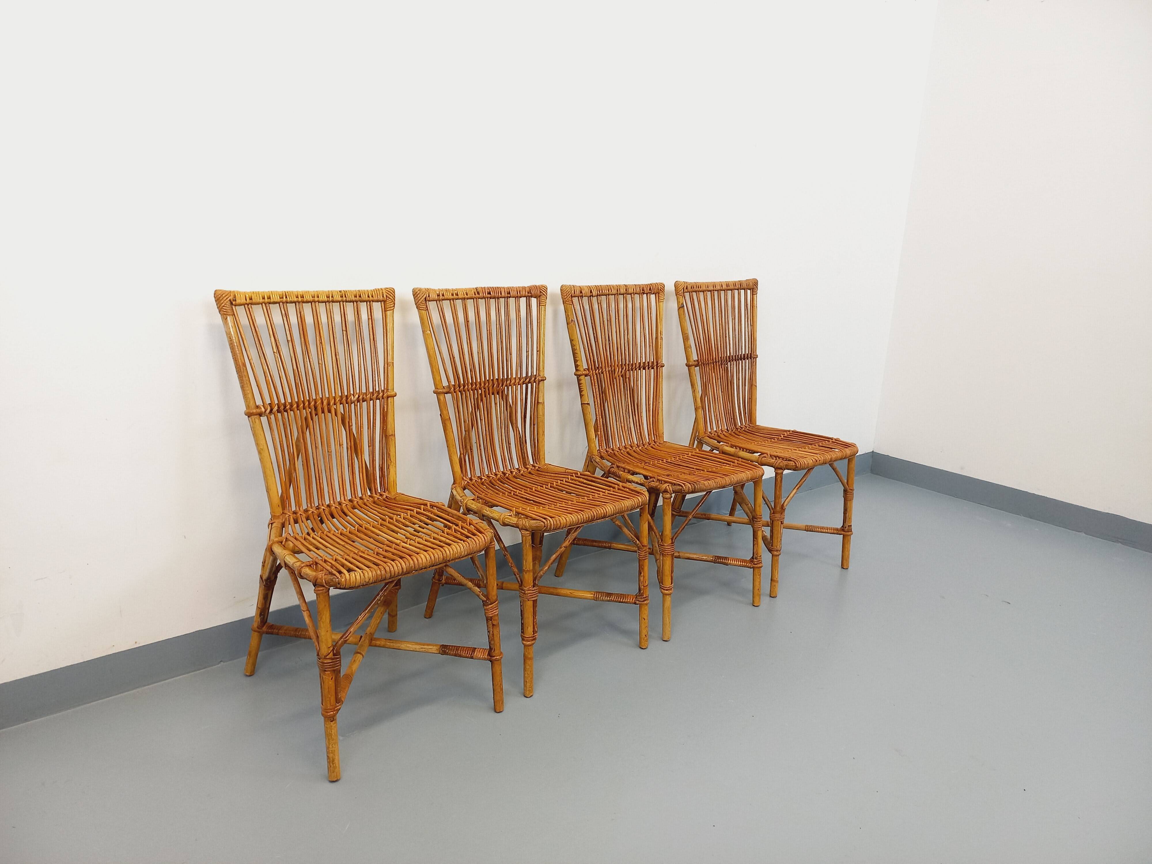 Set of 4 vintage Audoux Minet rattan chairs from the 1950s and 60s.