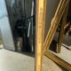 Miroir doré style Restauration à décor de palmettes étirées