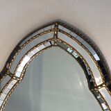 Mirror consisting of multi-faceted mirrors and brass garlands, French work, around 1970