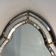 Mirror consisting of multi-faceted mirrors and brass garlands, French work, around 1970