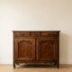 Old low sideboard in solid wood with drawers and doors.