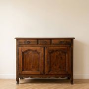 Old low buffet in solid wood with drawers and doors.