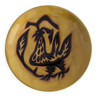 Terracotta plate by Jean Lurçat decorated with a rooster on a yellow background