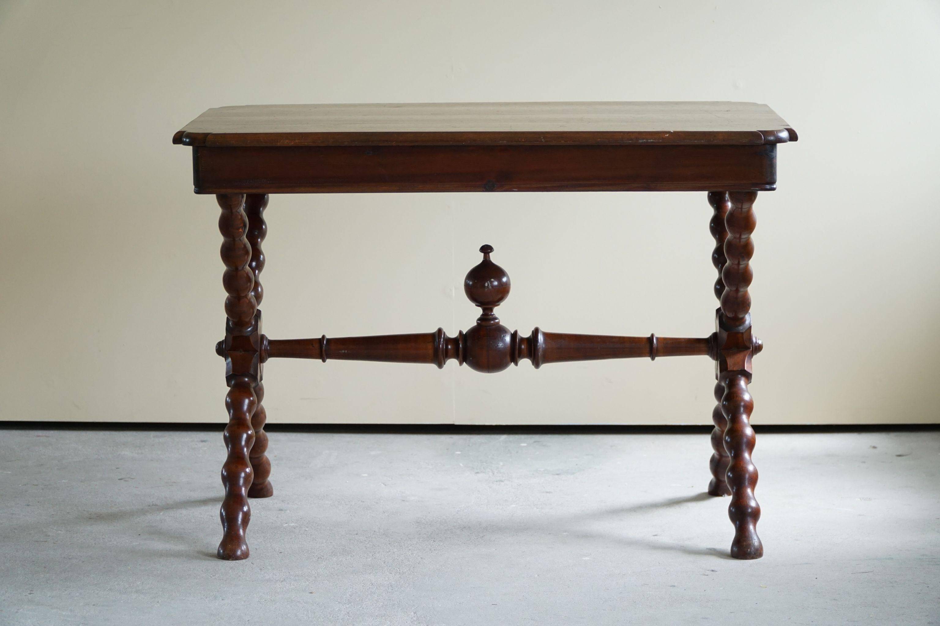 French sculptural desk in stained pine, early 20th century, Baroque style.
