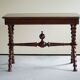 French sculptural desk in stained pine, early 20th century, Baroque style.