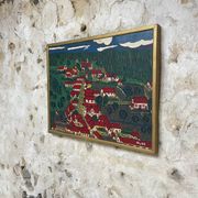 Peinture le village aux toits rouge