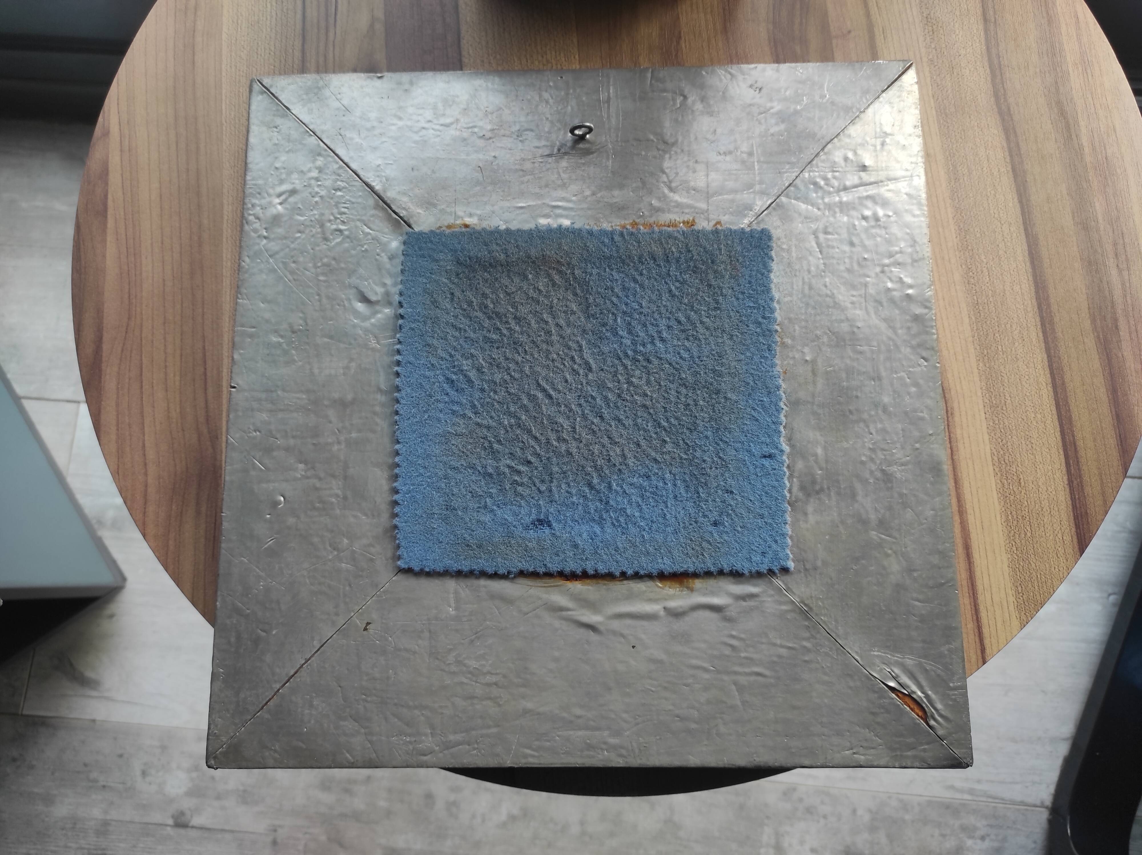 Vintage square mirror in wood covered with metal leaf, moldings in relief