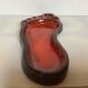Red ceramic footprint catchall.