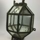 Metal and brass wall light with mirror background 1900