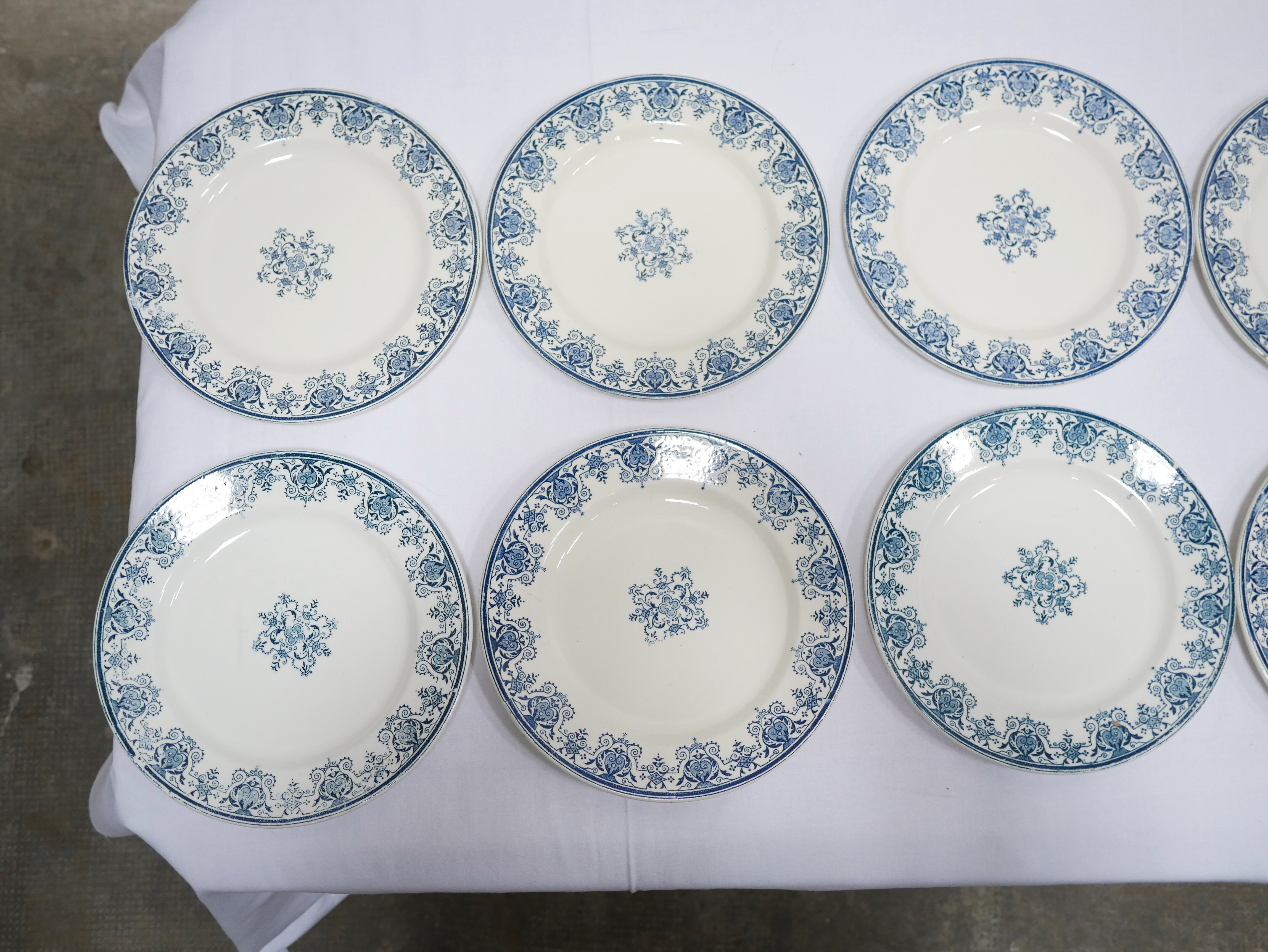 Series of 10 old Terre de Fer plates by L.G. for the earthenware factory of Clairefontaine