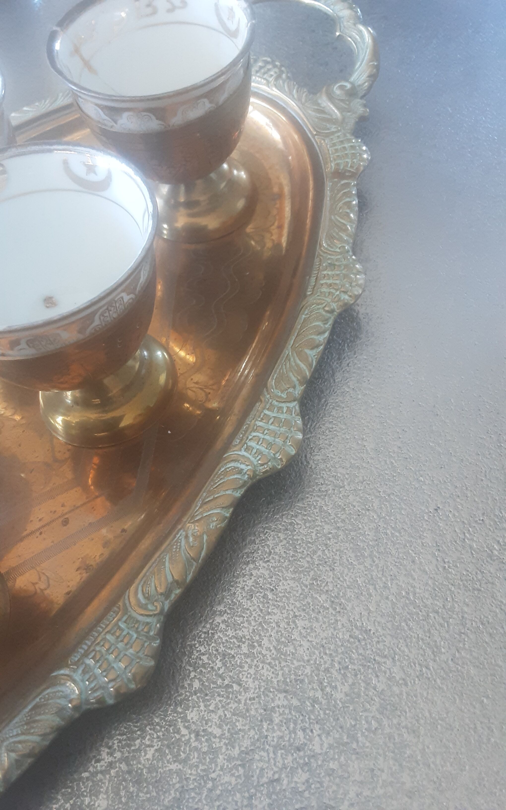 Old service porcelain brass cups